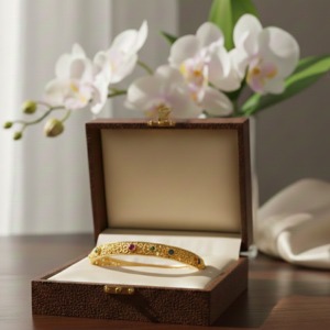 Gold-Toned Leaf Motif Ruby Bangle BA